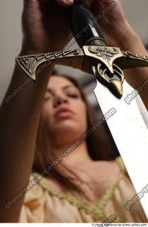 15 2018 01 BARBORA KNEELING POSES WITH SWORD